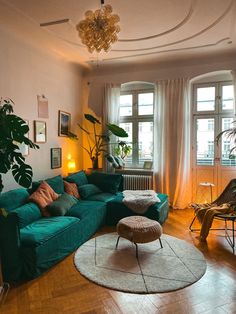 a living room filled with furniture and lots of windows