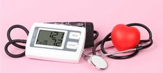 a blood pressure monitor with a red heart on it and a stethoscope