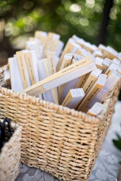 wicker baskets filled with business cards on a table