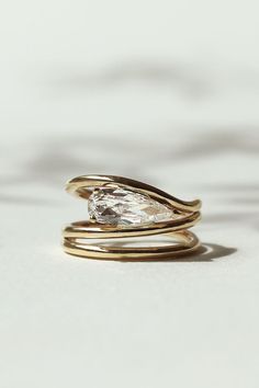 Elongated Pear Diamond Helix Ring Sunrise Engagement Ring, Unique Modern Wedding Rings, Beveled Ring Engagement, Chic Wedding Ring, Old Diamonds New Setting, Contemporary Ring Design, Unique Modern Engagement Rings, Funky Wedding Rings, Engagement Ring With Unique Band