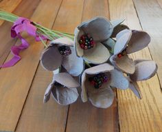 a bouquet of flowers sitting on top of a wooden table