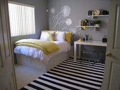 a bedroom with yellow and white decor in it