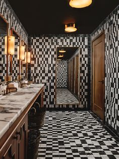 a black and white checkered bathroom with double sinks