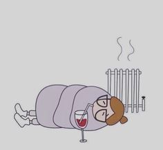 a person laying on the ground with a glass of wine