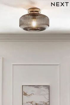 a light that is on in the ceiling above a door with text overlay reading next to it