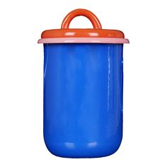 a blue pot with an orange lid and handle on it's side, sitting in front of a white background