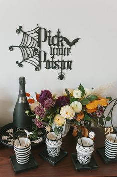 a table with vases and flowers on it next to a sign that says pick your push