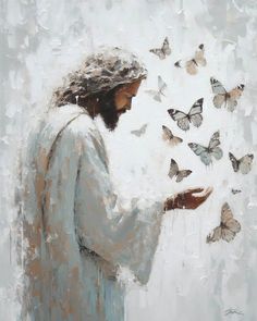 a painting of jesus surrounded by butterflies in white and blue colors, looking down at his hand