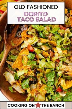 an old fashioned taco salad in a wooden bowl