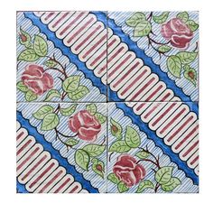 four tiles with roses on them in blue, red and white stripes are arranged around each other