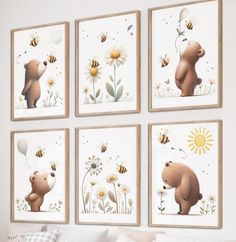 four framed pictures of bears and bees on a wall above a bed in a bedroom