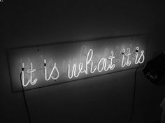 a neon sign that says it's what it is