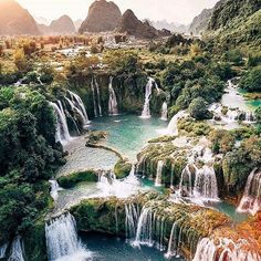 the beautiful waterfalls are surrounded by green trees