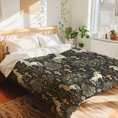 a bedroom with a bed covered in a blanket