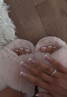 a woman's feet with pink and white nails