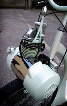 the front end of a motorcycle parked in a parking lot