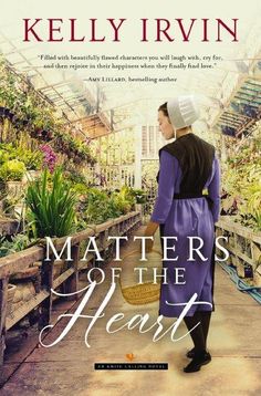 the cover of matters of the heart by kelly irvin, with an image of a woman holding a basket