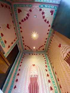 an artisticly designed ceiling in a building with hearts painted on the walls and floor