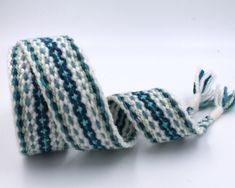 a blue and white striped ribbon with tassels