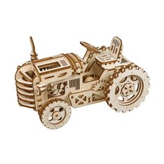 a wooden model of a tractor with gears