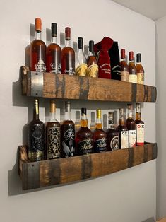 there are many bottles of liquor on the shelves