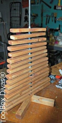 a piece of wood sitting on top of a wooden table next to a tool holder