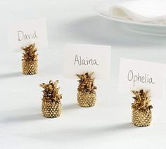 four place cards with pineapples on them