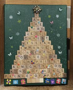 a christmas tree made out of scrabble tiles