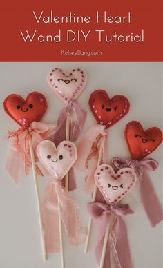 four heart - shaped lollipops with bows and sequins on them