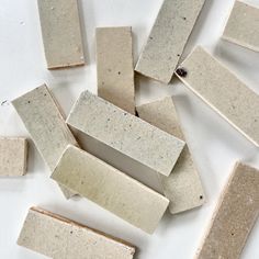 several pieces of cement sitting next to each other on top of a white countertop