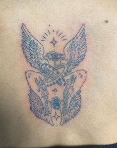 a tattoo on the back of a woman's chest with an angel and cross