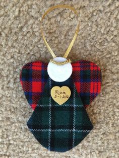 an ornament with a heart hanging from it's side on the carpet