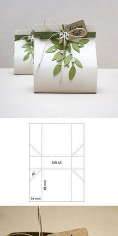 the packaging is wrapped in white paper with green leaves on it and has a tag that says