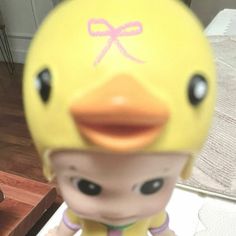 a yellow rubber ducky toy sitting on top of a table