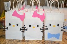 hello kitty bags with bows on them are ready to be used as favors for a birthday party