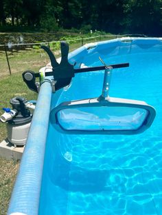 an above ground swimming pool is shown in the grass and has no cover on it