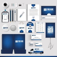 various stationery items are displayed on a white surface with blue and gray accents, including a logo, business cards, envelopes, pens, markers, and more