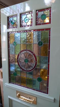 a close up of a door with stained glass