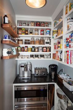 the pantry is stocked with many different types of food and condiments on shelves