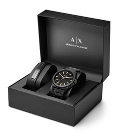 From AX Armani Exchange&#x2C; this watch features:black IP stainless steel braceletblack IP stainless steel round casematte black sunray dial with beveled index ring and gold-tone indexesquartz analog movementapprox. 44mm case size; 22mm bracelet width5 ATM water resistanceblack leather strap with logo-engraved black IP bar plaque includedImported. Watch Leather Strap, Luxury Gifts For Men, Gift Box For Men, Men's Watches Luxury, Black Leather Watch, Premium Watches, Armani Exchange Men, Best Watches For Men, Watch Gifts