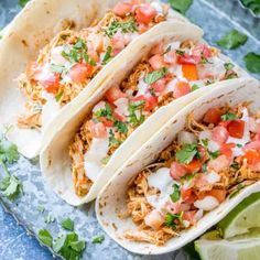 three chicken tacos with cilantro lime sauce on top and text overlay