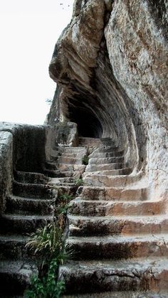 some stairs going up to the top of a cliff