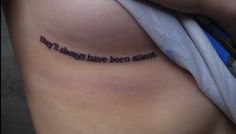 a woman with a tattoo saying, they'll always have been silent on her stomach