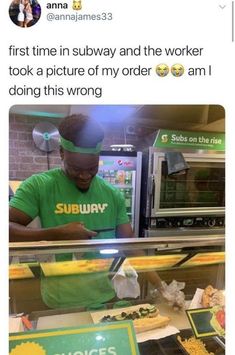 a man in green shirt standing behind a counter with food on it and an advertisement that reads, first time in subway and the worker took a picture of my order i am