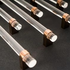 several tubes are lined up on a black surface