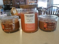 three jars of pumpkin spice sit on a table