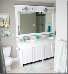 a bathroom with two sinks and a large mirror