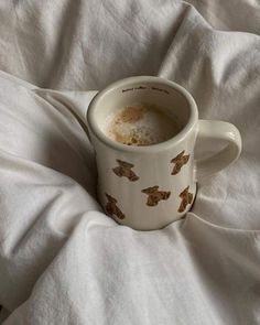 there is a cup that has been left on the bed