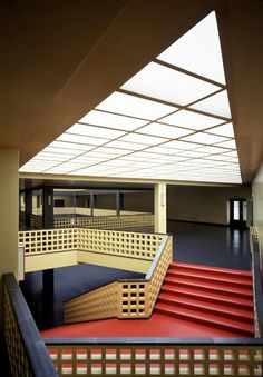 the inside of a building with stairs and railings