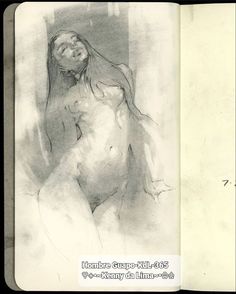 an open book with a drawing of a naked woman